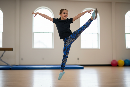 Child doing sports in blue and gray swirl leggings
