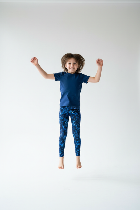 Child wearing Blue Music Symbol leggings - active